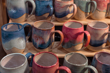 crafts fair, pottery, colorful handmade tea cups, tableware sale