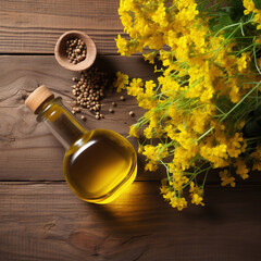 top view Still life with rapeseed oil in bottles and rape flowers as decortation on a wooden table with text space - obrazy, fototapety, plakaty