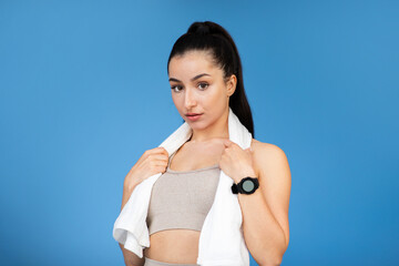 Headshot of attractive athletic woman with towel on her neck