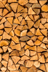 Chopped firewood piled up. Background concept of firewood