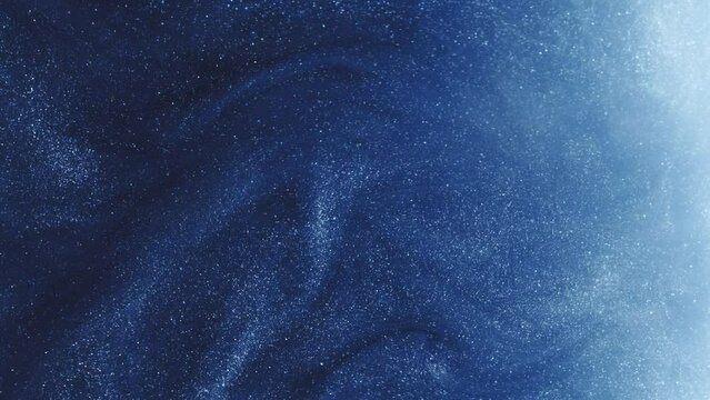 Vertical video. Glitter abstract background. Magic spell. Galaxy blue shimmering glowing fluid paint flow hypnotic ethereal mysterious captivating fantasy magic art.