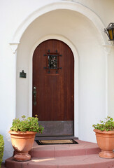 Fototapeta na wymiar vintage front door with a beveled alcove and a speakeasy look through door