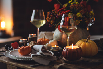 Atmospheric autumn elegant beautiful table setting with pumpkins for a wedding or thanksgiving...