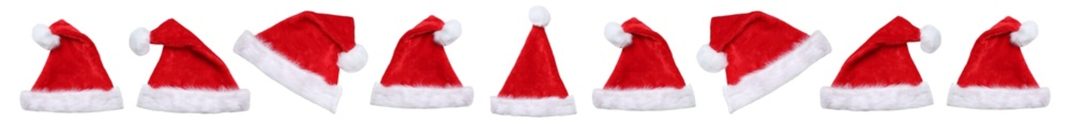 Christmas Santa Claus hats hat in a row winter panorama isolated on a white background