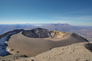 Crater of Misti Volcano, in the distance you can see San José Lagoon and PichuPichu Volcano.