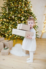 Little girl near Christmas tree