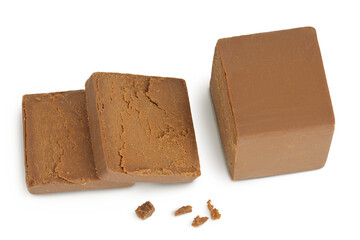 Brown cheese. Norwegian brunost isolated on white background. Top view. Flat lay