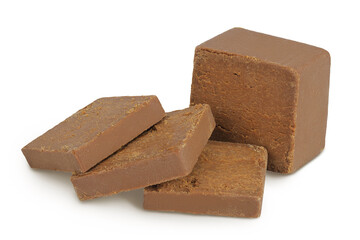 Brown cheese. Norwegian brunost isolated on white background with full depth of field