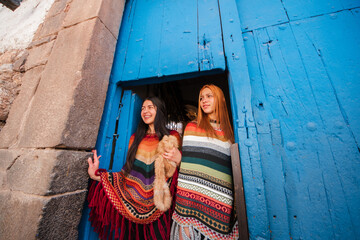 friends travelling on traditional clothes cusco peru