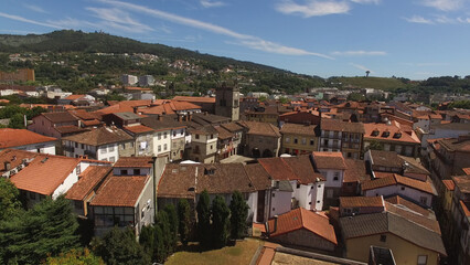 Fototapeta na wymiar Aerial Photography of Historic City Center of Guimarães in Portugal. Oliveira Church and Square. Travel Destination. Famous Place