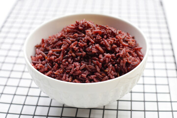 Cooked black rice in bowl