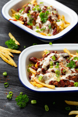 Chili Cheese Potato Fries topped with hot minced beef and cheese sauce