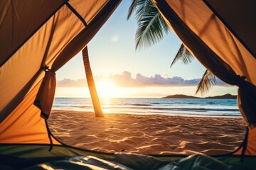 View from a tent at sunset at sand beach the beautiful seascape on tropical island. Summer tropical vacation concept.