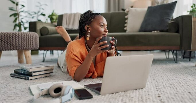 Laptop, education and a student black woman on the floor of a living room to study for a test or exam. Computer, smile and a happy young person learning with an online course for upskill development