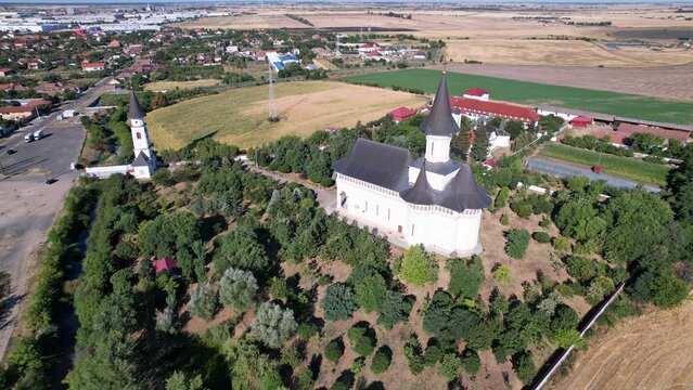 Aerial shot of Gai Monastery on a sunny summer day in the town of Arad, Romania