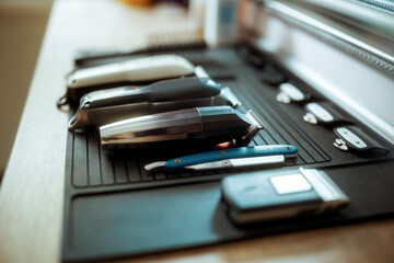 Closeup on hair clippers in modern beauty salon