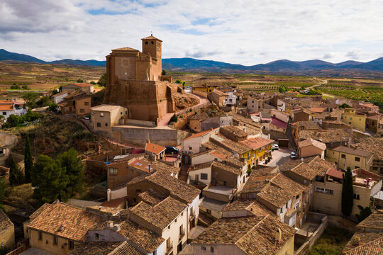 View from drone of Spanish village Cervera de la Canada and church of Santa Tecla, part of the UNESCO World Heritage Site