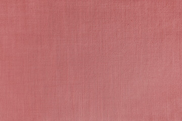 Fototapeta premium Texture background of red linen fabric. Textile structure, cloth surface, weaving of natural cotton fabric closeup, backdrop, wallpaper.