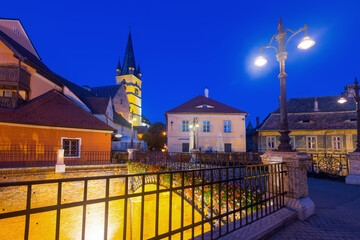 Twilight image with Sibiu streets and Cathedral of Saint Mary, Romania.