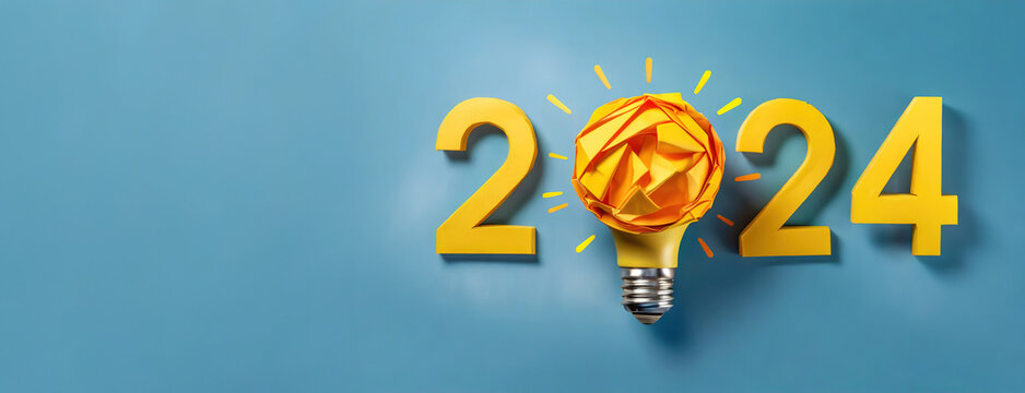 Yellow numbers 2024 year with burning light bulb on blue background. Creative idea card for New Year.
