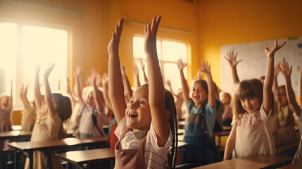 Children raise their hands to answer in the classroom. Back To School concept. Backdrop with selective focus. School restart
