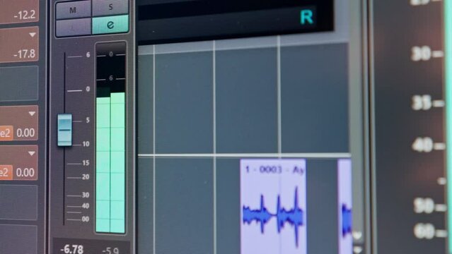 Computer monitor screen of a sound engineer showing audio tracks for mixing new soundtrack