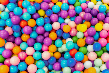 Fototapeta na wymiar Background of multicolored balls. Children's play pool.