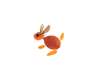 abstract bunny made of autumn leaves, foliage flat lay 