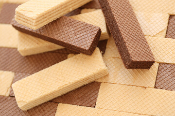 Stacked delicious chocolate wafers in large amount. Two different flavours of classic small waffles - obrazy, fototapety, plakaty