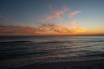 Colorful evening cloudscape after sunset over Gulf of Mexico off Panama City Beach, Florida.