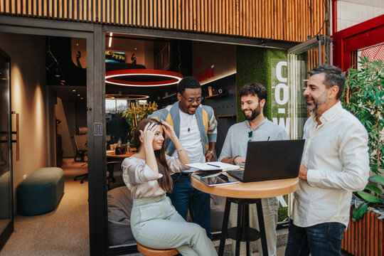 Dynamic Collaboration: Multiracial Team of Business Professionals Engaging in Creative Brainstorming for Profitable Growth and Innovation