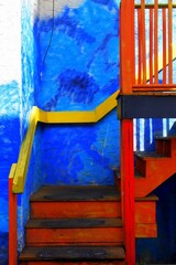 Vertical shot of a colorful staircase.