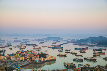 Fototapeta na wymiar Xiaoruo Village, Wenling City, Taizhou City, Zhejiang Province - high angle view of fishing village and fishing port at sunrise