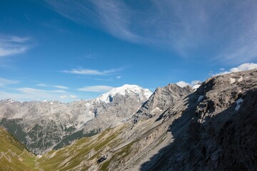 Fototapeta na wymiar Beautiful view of a high peaky and rocky mountain pass on daytime