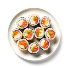 Top view of plate with sushi rolls on white background.