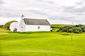 Nairn, Scotland - September 24, 2023: The iconic halfway house and ice shack on the Nairn Golf Course
 - obrazy, fototapety, plakaty