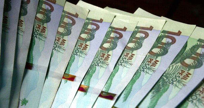 Fan of Colombian money bills pesos COP