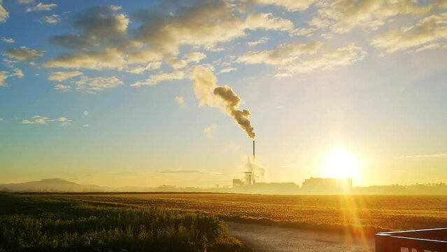 Smoking chimney of the Suedzucker company in Plattling, Bavaria, Germany, but it is probably water vapour, not exhaust fumes, Europe