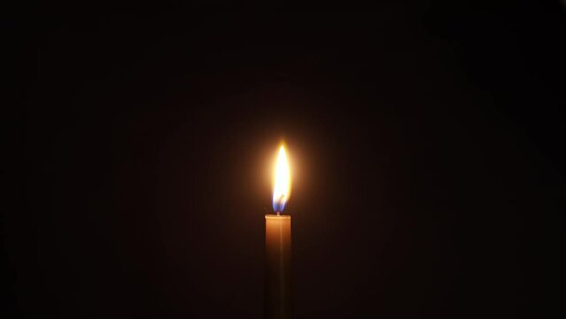 a candle burns in fast motion video