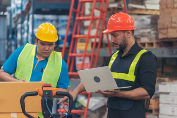Warehouse worker teamwork diversity men using laptop computer logistics checking products in store inventory. Warehouse management team partner engineer man work together checklist stock control