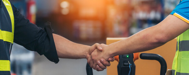 Banner Asian Teamwork Warehouse worker shakehand together. Engineer man, women handshake partnership. Coworker colleague logistics Warehouse teams. Team person shaking hand partner with copy space