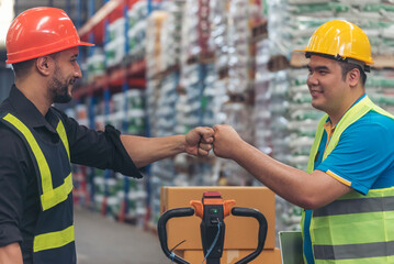 Teamwork Warehouse worker shakehand together. Engineer man hands partnership. Diversity Coworker...
