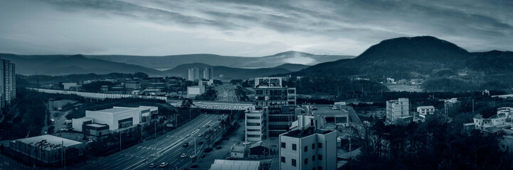Retro-style industrial cityscape in black and white colors, an aerial landscape at foggy winter morning in Wonju-si, Gangwon-do, South Korea - obrazy, fototapety, plakaty