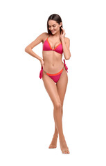 Fototapeta premium Young woman in stylish bikini isolated on white