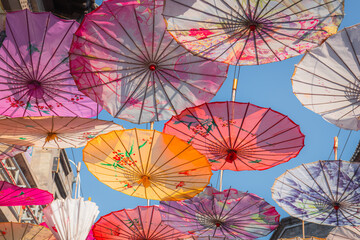 Fototapeta na wymiar Vibrant colorful Chinese style umbrellas at the umbrella street in Hohhot, China