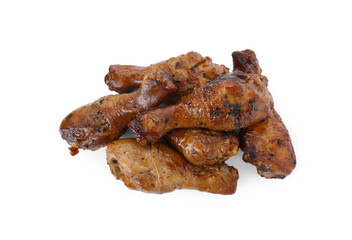 Pile of chicken legs glazed with soy sauce isolated on white, top view