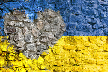 National flag of Ukraine with unpainted heart on old stone wall