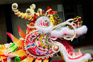 Fototapeta na wymiar Chinese Dragon Head On Street Prior To Parade
