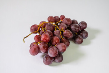 red grapes on white background
