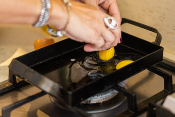 preparation of a tenderloin with rump steak with cheese, egg, bread, mayonnaise, ham and cheese